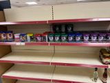 a shelf that has some food on it in a store