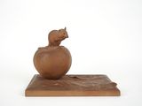 an image of a small figurine of a bear on a ball