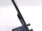 a close up of a cell phone on a stand