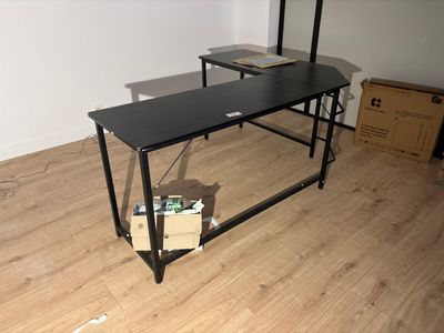 an image of a desk with a computer on top of it