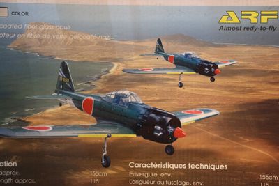 two small planes flying in the sky over a desert area