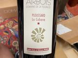a bottle of wine that is being held by a person
