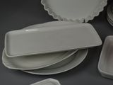 many plates and trays that are sitting on a table