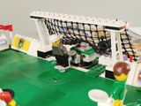 a lego soccer field with a goal on it