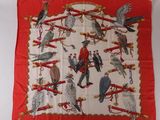 an image of a red and white scarf with birds on it