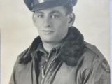 a black and white photo of a man in a military uniform