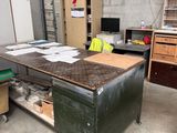an image of a workbench in a garage with a lot of clutter on it