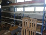 a room filled with lots of boxes and pallets