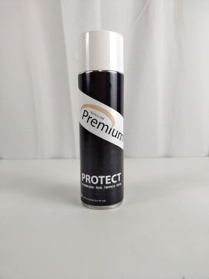 un vaporisateur blanc posé sur une table blanche
