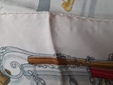 a purse that has a pen and a pencil inside of it