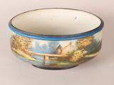 a bowl with a painting of a house on it