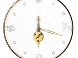 a clock that has a zodiac sign on it