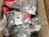 a cardboard box filled with a bunch of plastic items