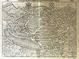 an old map of a city with a river and mountains in the background