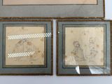 two framed drawings of a man and a woman sitting on a bench