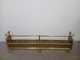 antique brass planter with ornate design on legs