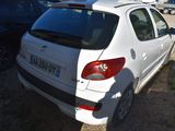 a small white car parked in a parking lot