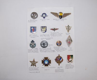 a lot of military badges on a piece of paper