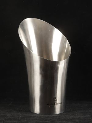 a silver cup that is sitting on a table