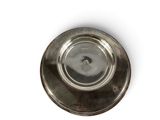 a silver plate on a white surface with a white background