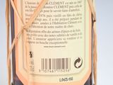 a bottle with a label on it wrapped in twine