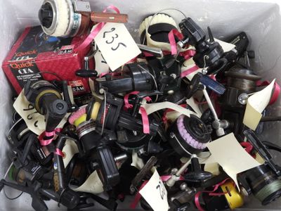 a box full of assorted cameras with tags on them