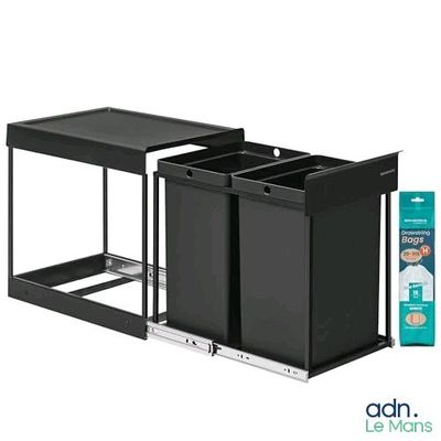 two black trash cans sitting next to each other on a shelf