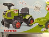 a toy tractor that is in the box on the table