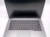 an open laptop computer sitting on top of a white table