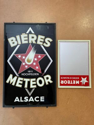 a sign and a plaque on the wall of a restaurant