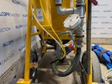 a machine that has a hose attached to the back of it
