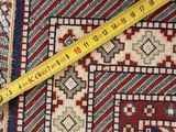 rug with a measuring tape on top of it next to a piece of fabric