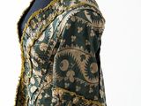 an image of a green and gold jacket on a mannequin