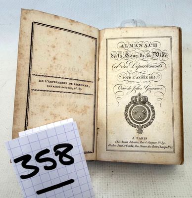 a small book that is open on a table