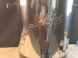 a large metal pot that is sitting on a table