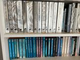 many books on a book shelf in a library