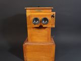 an old wooden box with two speakers sitting on top of it