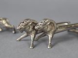 silver plated figurines of a ram and a ram with horns