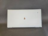 a white laptop computer sitting on top of a table