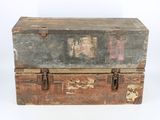 an old wooden trunk with a metal latch on it