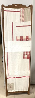 a towel rack with a towel on it in a kitchen