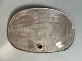 a metal tray with a hole in it on a table