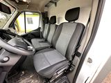 the interior of a van with the driver ' s seat folded down