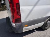 a white van that is parked on the side of the road