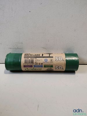 a close up of a roll of green paint on a table