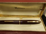 an image of a pen in a box on a table