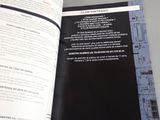 a book open to a page with a picture of a building