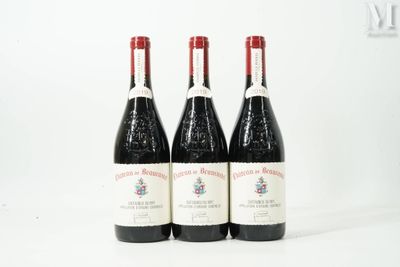 three bottles of wine sitting on top of a table next to each other