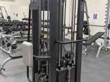a gym with a lot of machines in the room