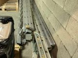 a pile of metal bars sitting on a pallet in a warehouse